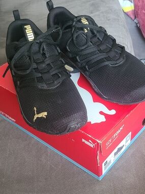 Puma Black Sneakers with Gold Insole Accent
